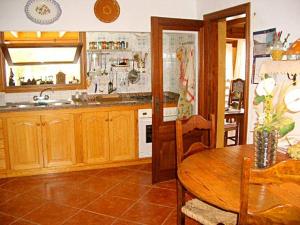 The large country style kitchen is fully equipped with microwave,oven, hobs, toaster, kettle etc