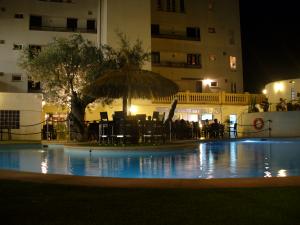 Enjoy a meal or drinks by the pool in the evening